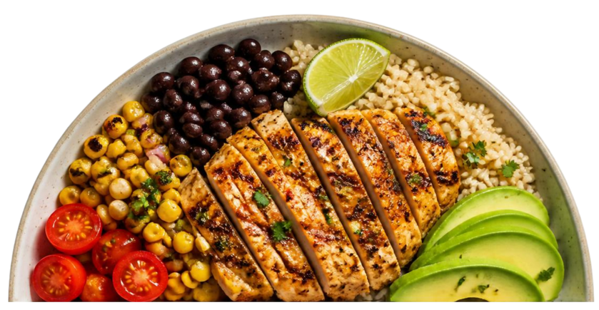 A half of a plate filled with baked chicken breast, couscous, sliced avocado, black beans, cherry tomato halves, and a lime wedge.